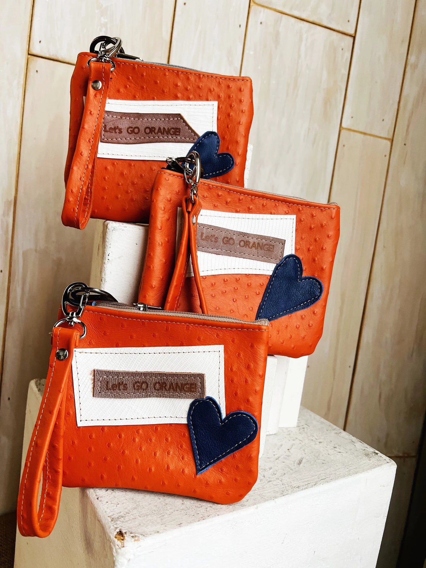 Let’s go orange leather stadium wristlet
