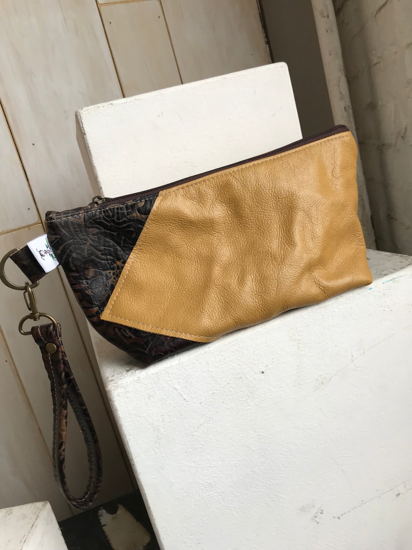 Square bottom clutch mustard with mocha embossed